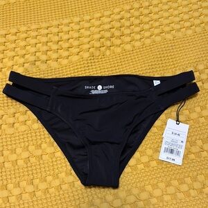 New with tags. Black side slit bikini bottoms size small